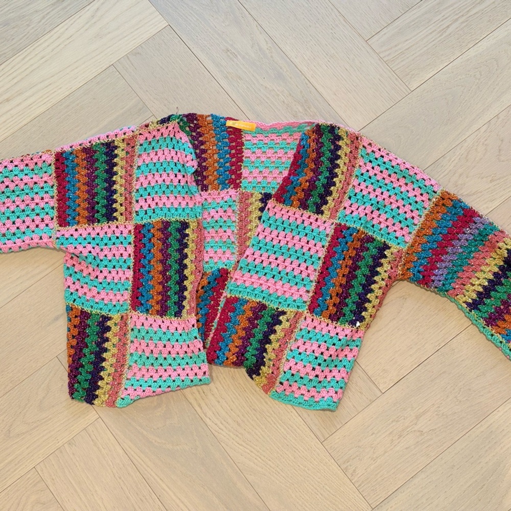 Rose Carmine hand-knit bolero jacket.